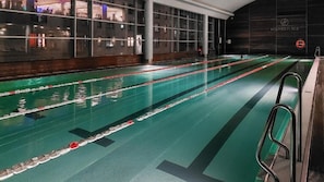 Swimmers can enjoy a refreshing dip in the hotel's indoor pool, marked with lane dividers for a safe and enjoyable experience.