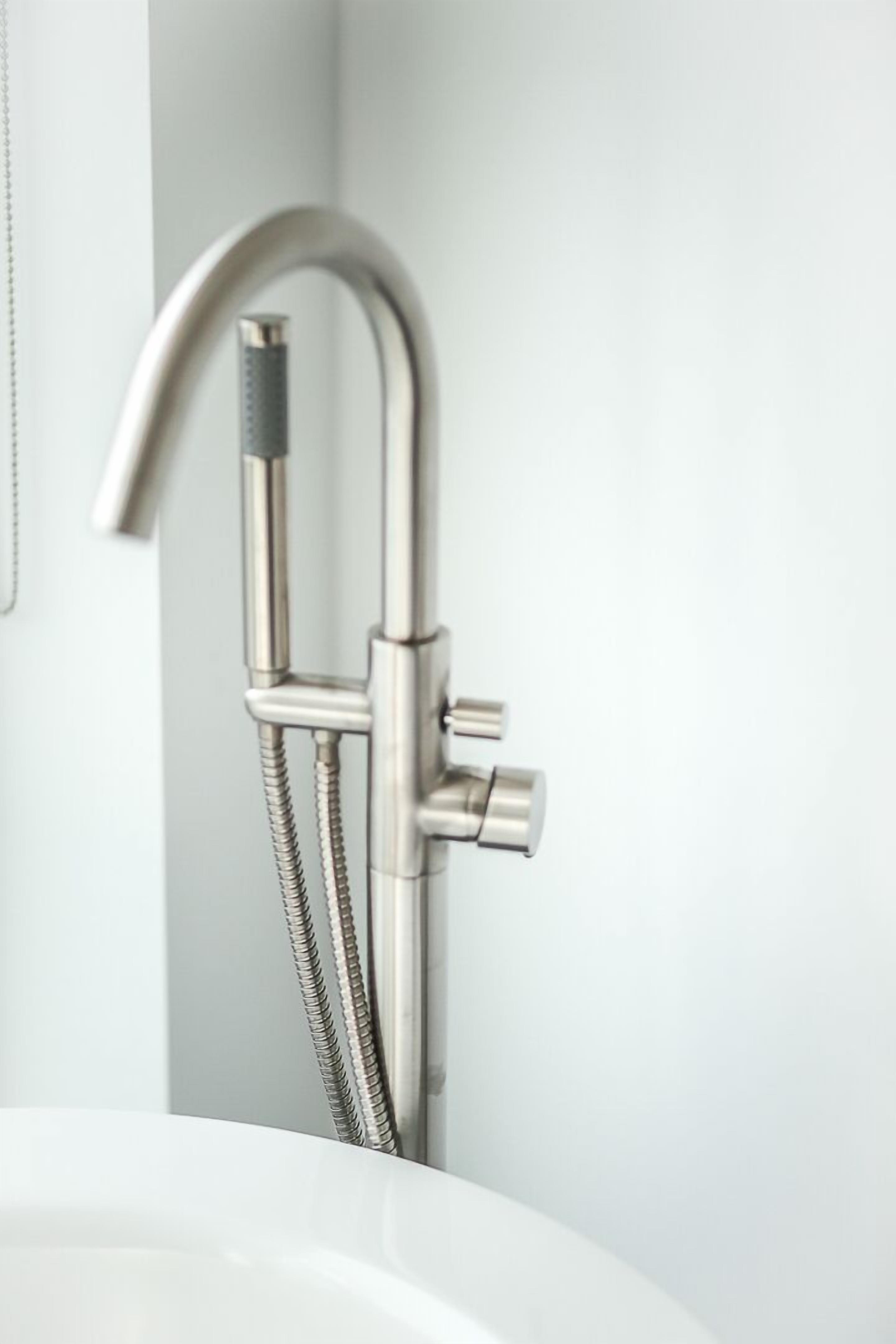 A modern bathroom with a sleek, metallic shower faucet and a flexible hose.