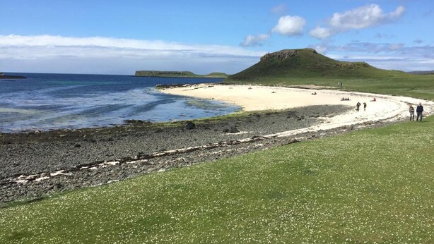 A coastal landscape with a sandy beach, rocky shoreline, and a grassy hill. - Lovely House Near Loch Ness in Scotland, UK (Inverness)