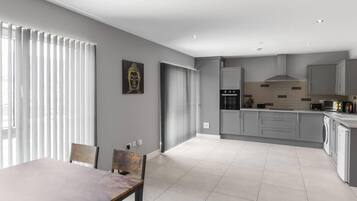 Apartment, 1 Queen Bed | Private kitchen | Fridge, microwave, oven, stovetop