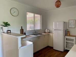 Fridge, coffee/tea maker, cookware/dishes/utensils