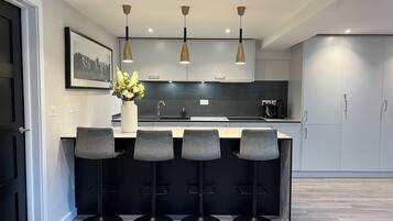 Apartment, 1 King Bed | Private kitchen | Fridge, microwave, oven, stovetop