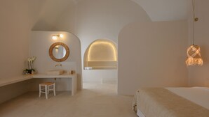 A modern bathroom with a vanity, sink, and mirror.