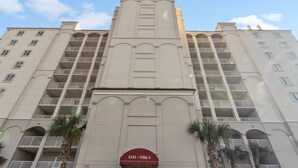 A multi-story hotel with a prominent entrance labeled "2151 - Villa 2". - Yacht Club Villas #2-405 Extraordinary and Spacious Condo! (North Myrtle Beach)