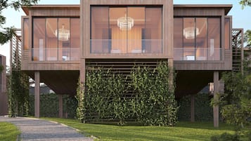 A modern two-story building with large windows and a central staircase.