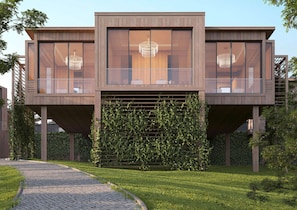 A modern two-story building with large windows and a central staircase. - Katara Hills Doha, Lxr Hotels & Resorts (Doha)