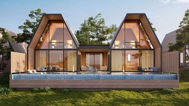 Een modern huis met een zwembad, grote ramen en een plat dak.