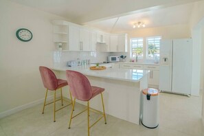 Fridge, microwave, oven, stovetop - Modern 3-Bedroom Home - Harbour Breeze (Saint Mary)