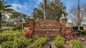 A brick entrance sign for Edgewater Park & Municipal Marina in the City of Dunedin.