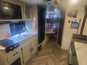 Fridge, microwave, stovetop, coffee/tea maker