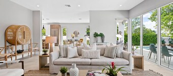 The Riverhouse – A Stunning Modern Heated Pool Retreat with Serene and Scenic Waterway Views!