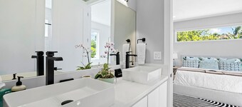 The Riverhouse – A Stunning Modern Heated Pool Retreat with Serene and Scenic Waterway Views!