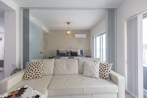 Apartamento | Zona de estar | Televisión LCD de 40 pulgadas con canales por cable, una televisión