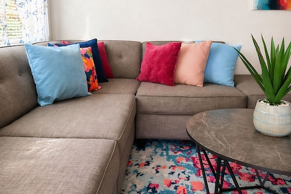 Settle into our stylish living room, offering comfortable sofas and a welcoming