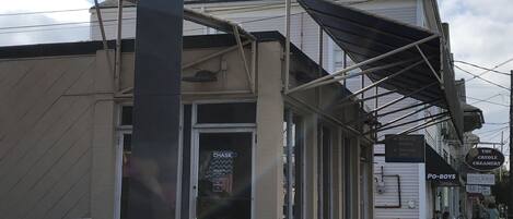 A commercial building with a 'CHASE' sign, a drive-up window, and a 'The Creole Creamery' sign.