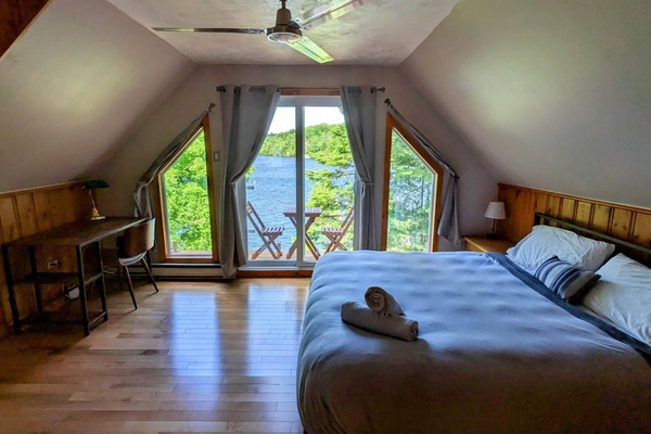 Master bedroom with panoramic glass railing