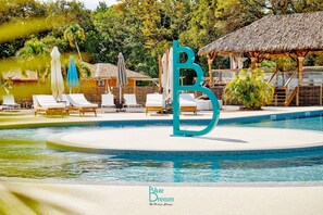 Outdoor pool - Set in a lush green area, your bungalow is  a few steps from a natural beach. (Grand-Bourg)