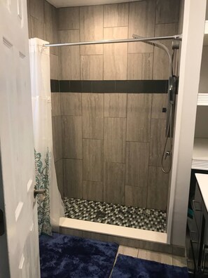 Shower, towels, soap, toilet paper