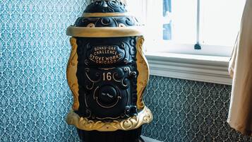 A vintage stove with intricate designs and a label that reads "Bonny Oak Challenge Stove Works Chicago."