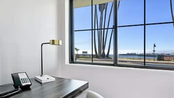 Premium Room, 1 King Bed, Partial Ocean View | Pillow-top beds, in-room safe, desk, laptop workspace