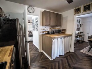 Microwave, toaster, cookware/dishes/utensils, dining tables