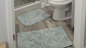 A bathroom with a glass shower enclosure, a toilet, and a towel rack. - Lovely 1 Bedroom with a Pool (Jupiter)
