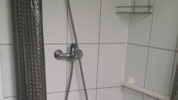 Shower, hair dryer, towels, toilet paper