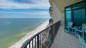 A balcony with a view of a beach and ocean. - Phoenix West 2207 Upscale Luxury | Updated | Beachfront | Waterslide-Lazy River (Orange Beach)