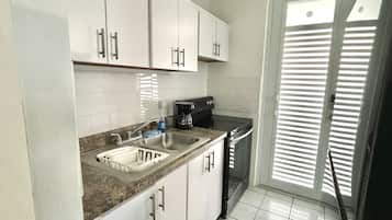 Fridge, microwave, stovetop, coffee/tea maker