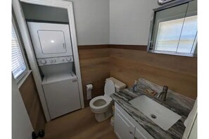 Combined shower/bathtub, hair dryer, towels, soap
