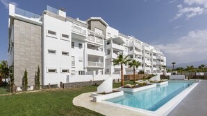 A modern multi-story hotel with a swimming pool, balconies, and a well-maintained lawn. - Ref. 377638 (Motril)