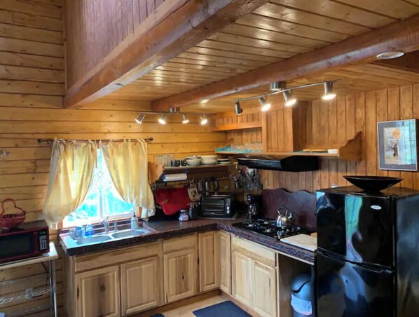 Fridge, microwave, stovetop, coffee/tea maker