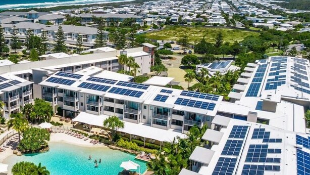 A resort with multiple buildings, a swimming pool, and solar panels on the roofs. - The Sand Resort Kingscliff -One Bed Spa Suite (4202) (Tweed)