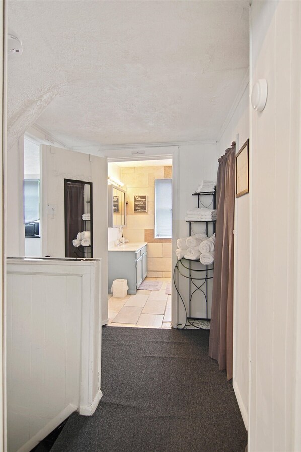 Hallway to bathroom has a stand with plenty of towels for your stay - Vibrant, Bright & Fresh in the Heart of Tamaqua (Tamaqua)