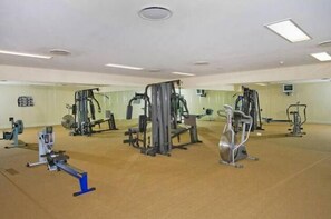 Work out in style with a variety of exercise equipment, including weight machines, a stationary bike, and a rowing machine.