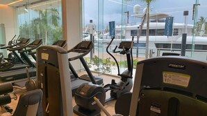 A gym with treadmills, weight machines, and exercise equipment. - CONDO NAUTICO BY TRVL2HM (Puerto Vallarta)