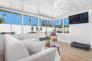 TV, fireplace, books