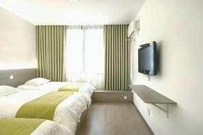 A hotel room with two beds, a TV mounted on the wall, and a window with curtains. - House 67, Yandang Mountain (Yueqing)