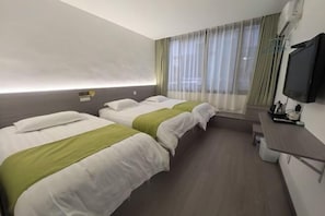 A hotel room with two beds, a TV, a desk, and a window with curtains. - House 67, Yandang Mountain (Yueqing)