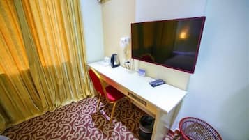 Desk, blackout drapes, bed sheets