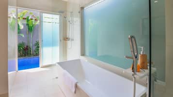 Bathtub, hair dryer, towels, shampoo