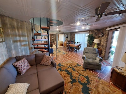 RIR: E Faye Jones style Rock floor to ceiling in 3 bathrooms open floor plan.