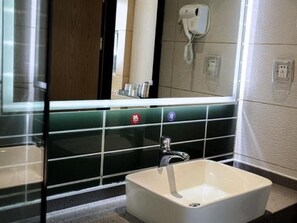 A bathroom with a white sink, a mirror, and a wall-mounted phone. - Greentree Inn Express Yingtan Yujiang Railway Station (Yingtan)