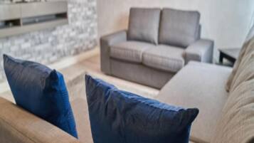 Premium Apartment | Living area | 40-inch flat-screen TV with digital channels, TV