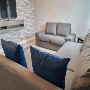 Premium Apartment | Living area | 40-inch flat-screen TV with digital channels, TV