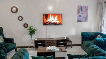 Deluxe Apartment | Living area | Smart TV