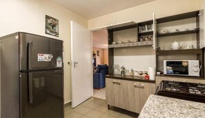 Departamento superior | Cocina privada | Refrigerador y horno 