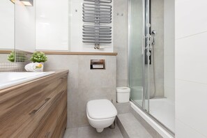 Shower, hair dryer, towels, shampoo