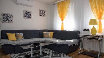 Apartment (One Bedroom Apartment) | Living room | 25-inch flat-screen TV with satellite channels, TV