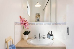 Bathtub, hair dryer, towels